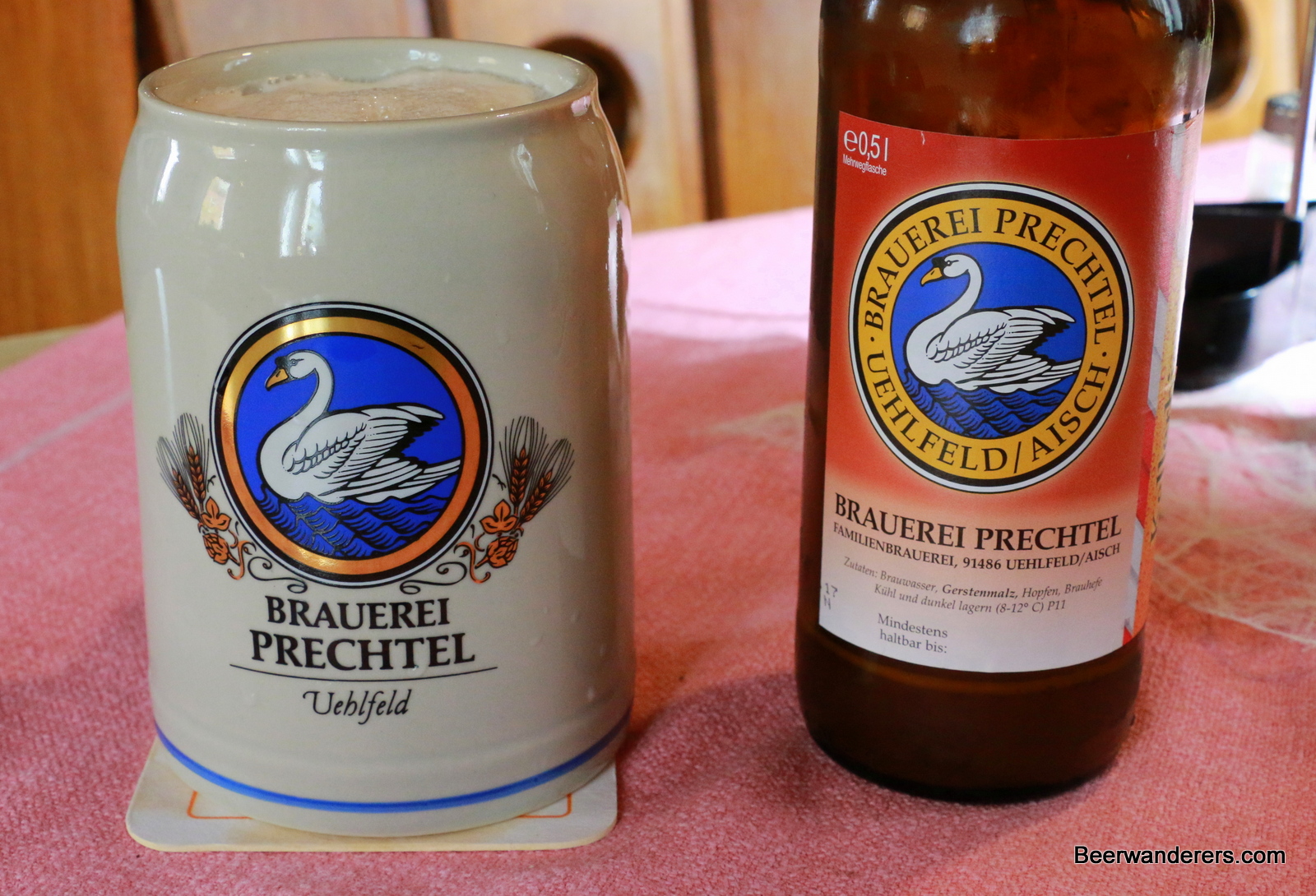 beer in ceramic mug with bottle