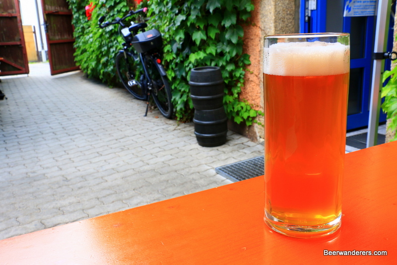 unfiltered amber beer in mug