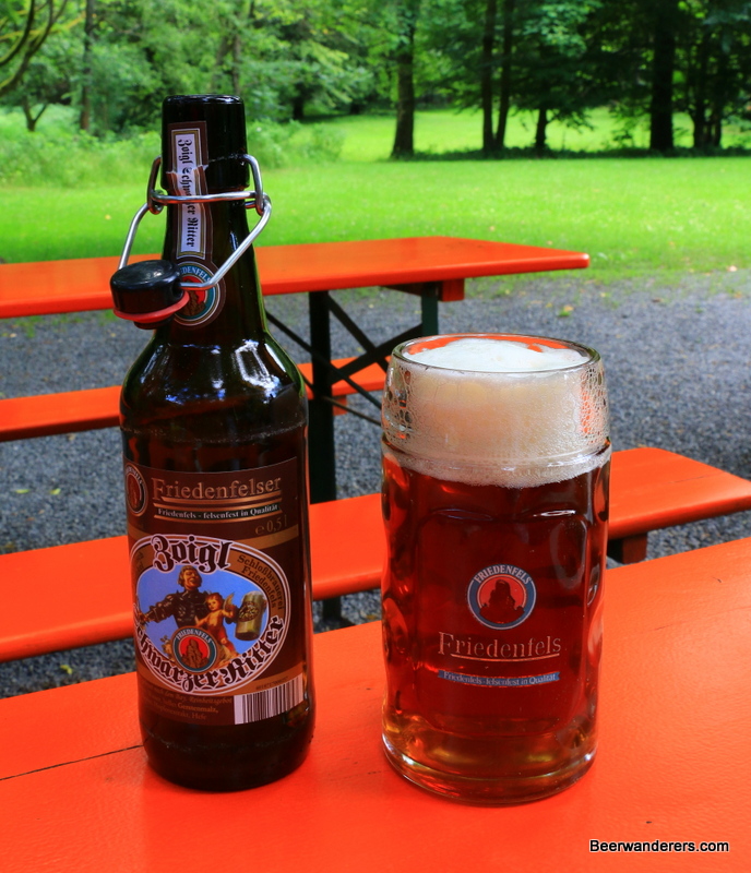 unfiltered beer in mug with bottle