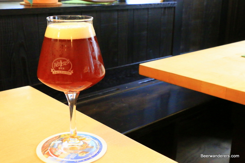 unfiltered amber beer in wine glass