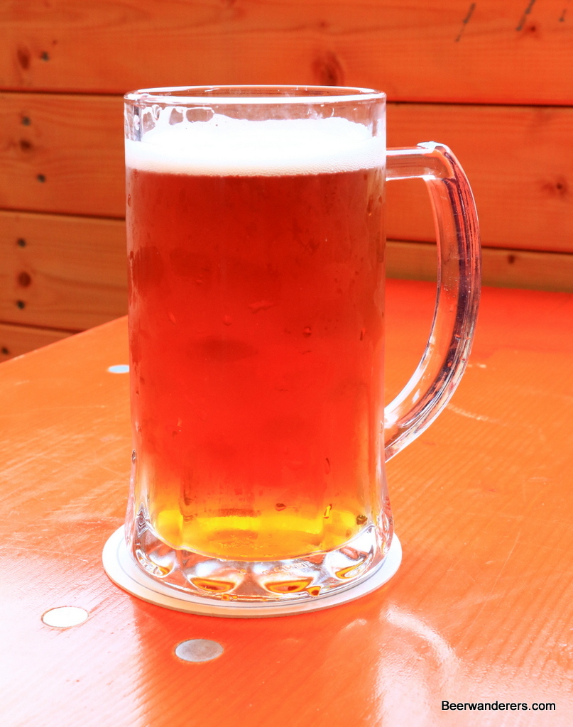 unfiltered amber beer in mug