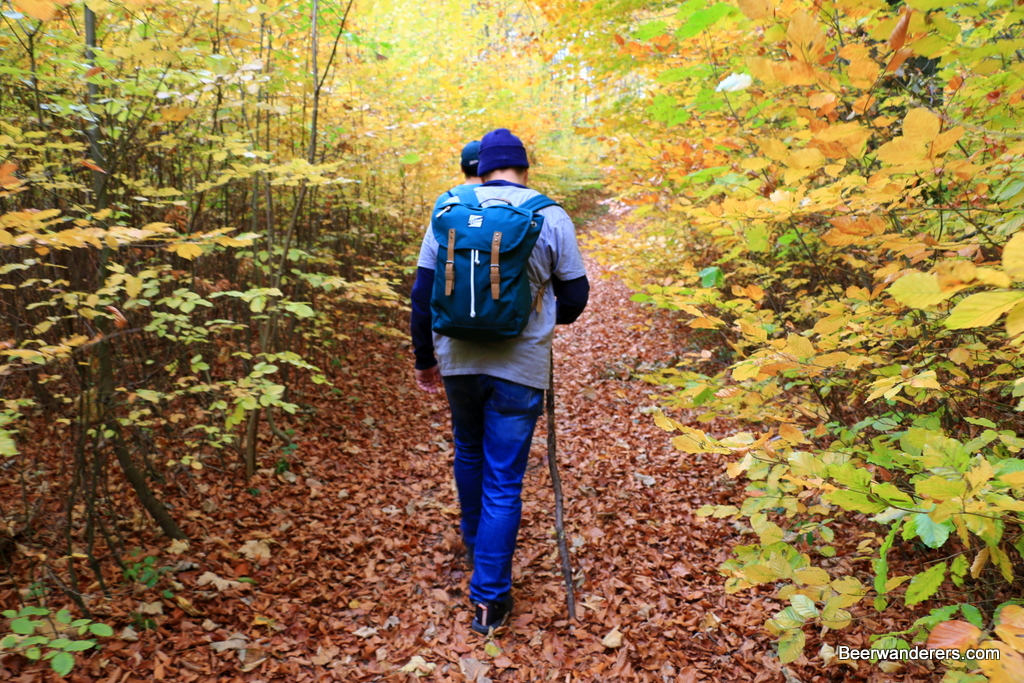 beer hikers on trail in autumn