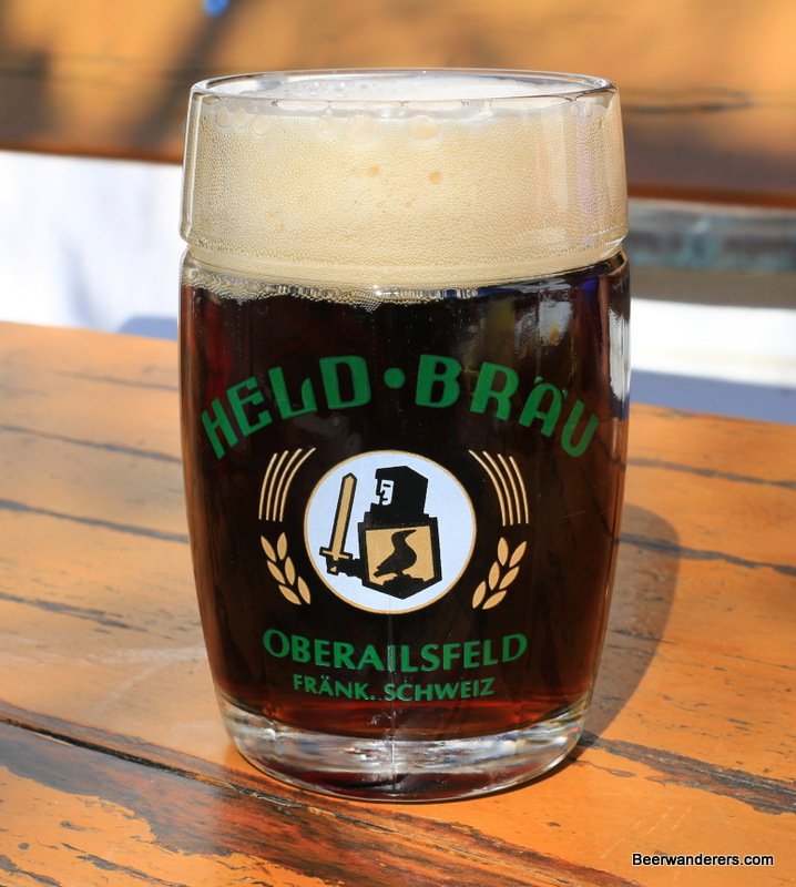 dark beer in mug with big head