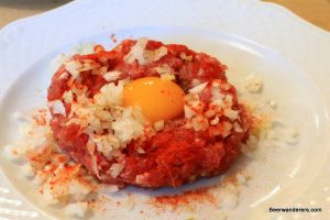 raw ground meat with a raw egg yold