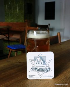 unfiltered beer in mug with coaster
