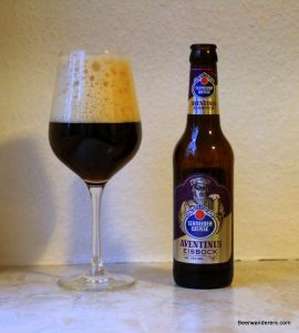 dark beer in wine glass with bottle
