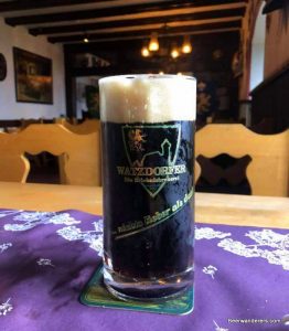 black beer in logo mug