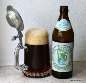 dark beer in pewter lidded mug with bottle
