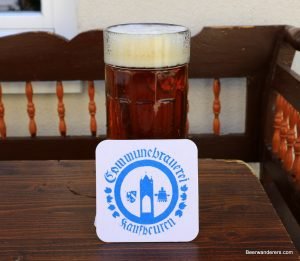 amber beer in mug with coaster