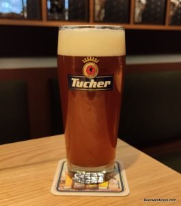 unfiltered red beer in logo glass