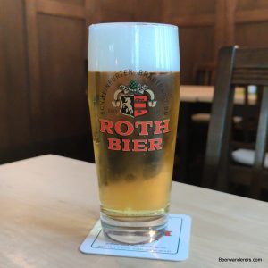 golden beer in logo glass
