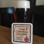 red beer in glass with beer coaster