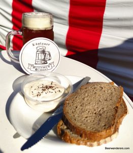 cheese dip with bread and beer