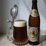 dark beer in pewter lidded mug with bottle