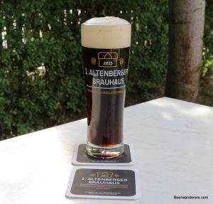 black beer in logo glass