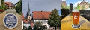 beer in ceramic krug, old village in germany, amber beer in logo glass
